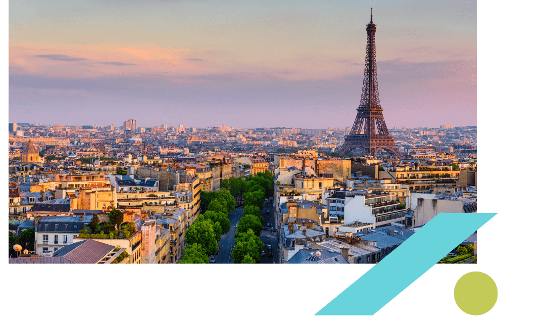 View of the Paris skyline at sunset with the Eiffel Tower to the right. View of the Paris skyline at sunset with the Eiffel Tower to the right.
