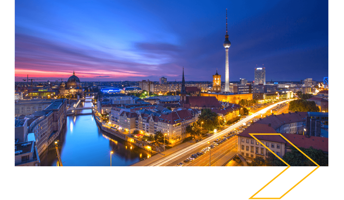 City skyline at sunset with a river to the left and a tall tower to the right. City skyline at sunset with a river to the left and a tall tower to the right.