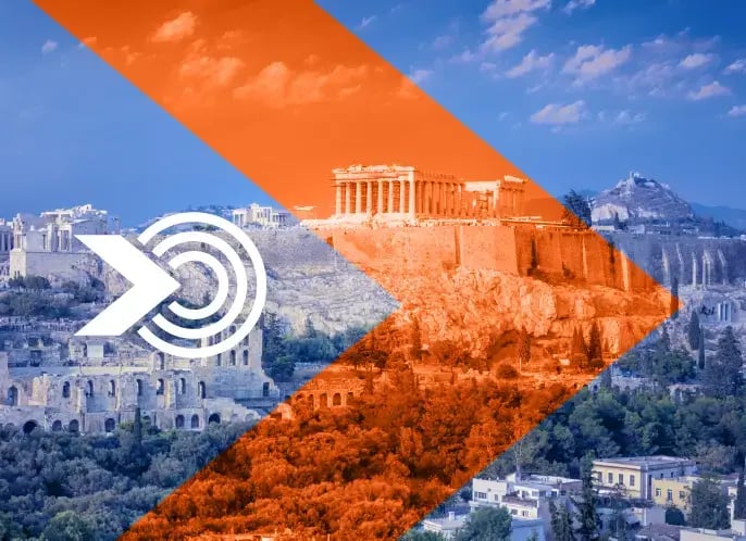 A panorama view at Athens and the Acropolis with an orange arrow on top.