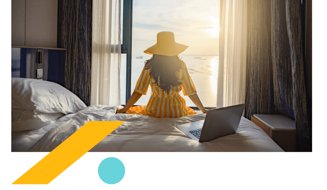 Woman in a sunhat sitting on a hotel bed, looking at the sea out of an open window. Woman in a sunhat sitting on a hotel bed, looking at the sea out of an open window.