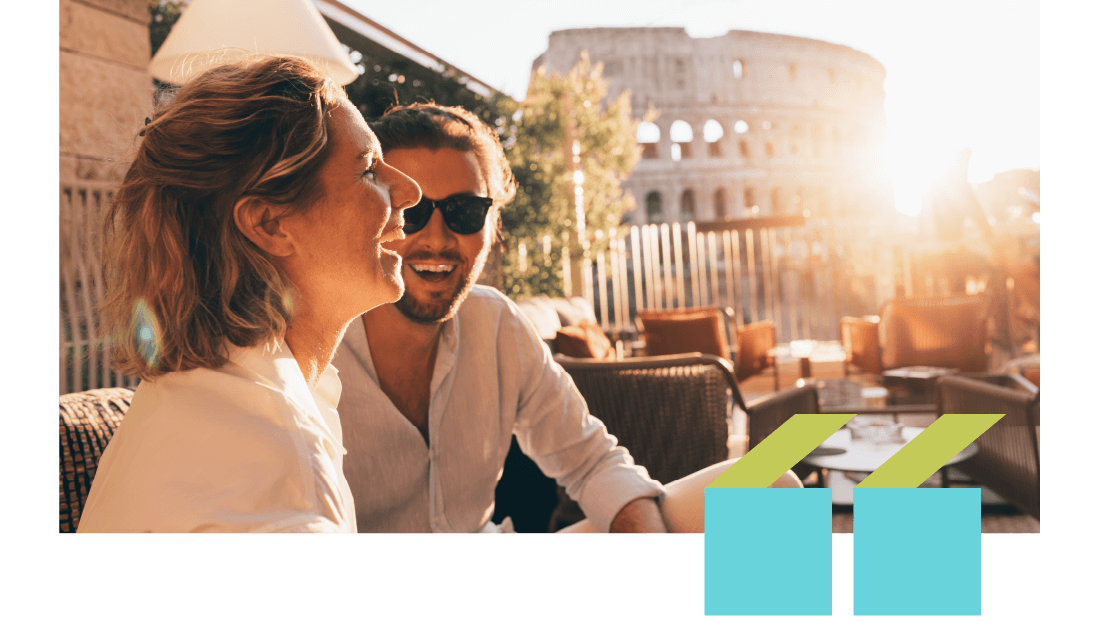 A smiling couple in an outdoor restaurant in Rome with the Colosseum in the background. A smiling couple in an outdoor restaurant in Rome with the Colosseum in the background.