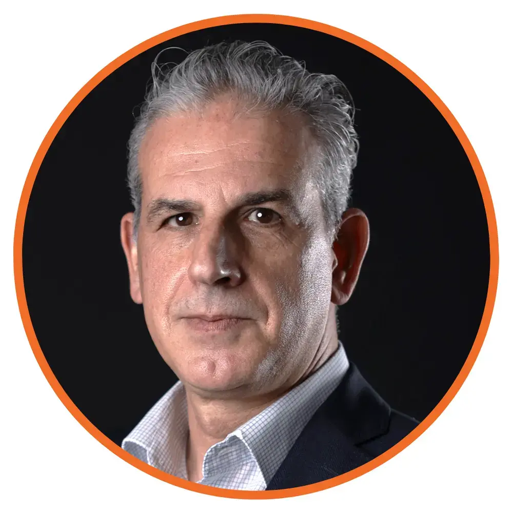 A headshot of Nikos Giokas, Plusgrade, in a circle frame. 
